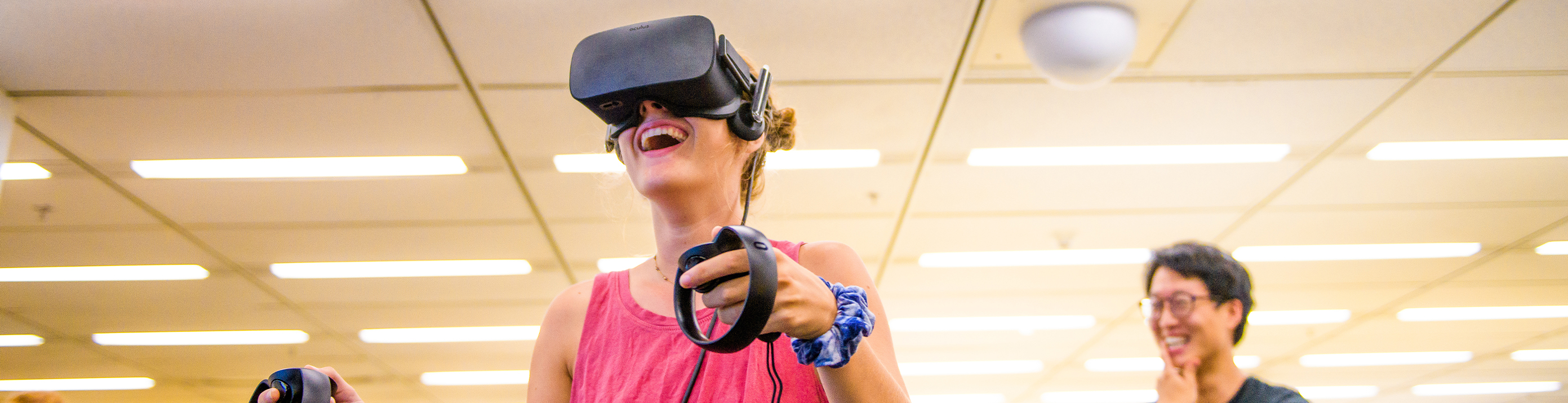 Women using VR headset.