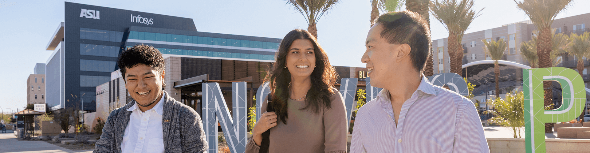 Students at ASU talking outside