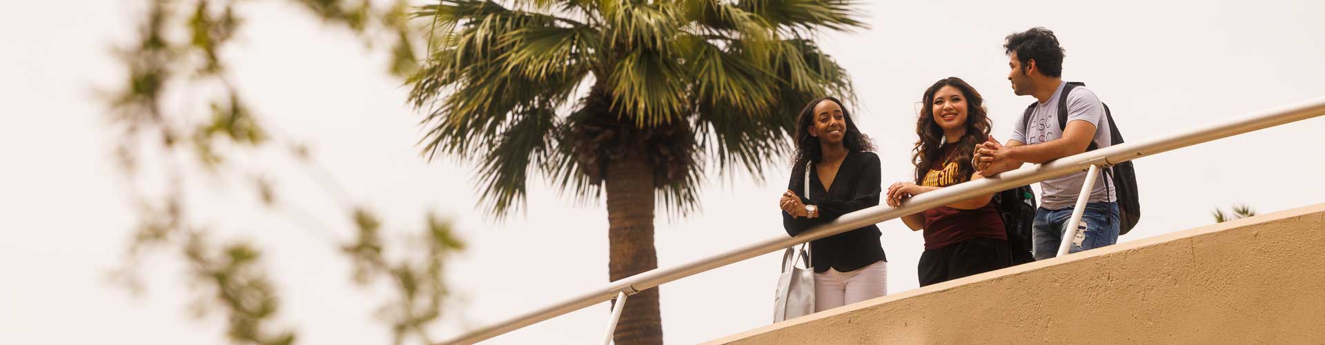 Students standing on bridge.